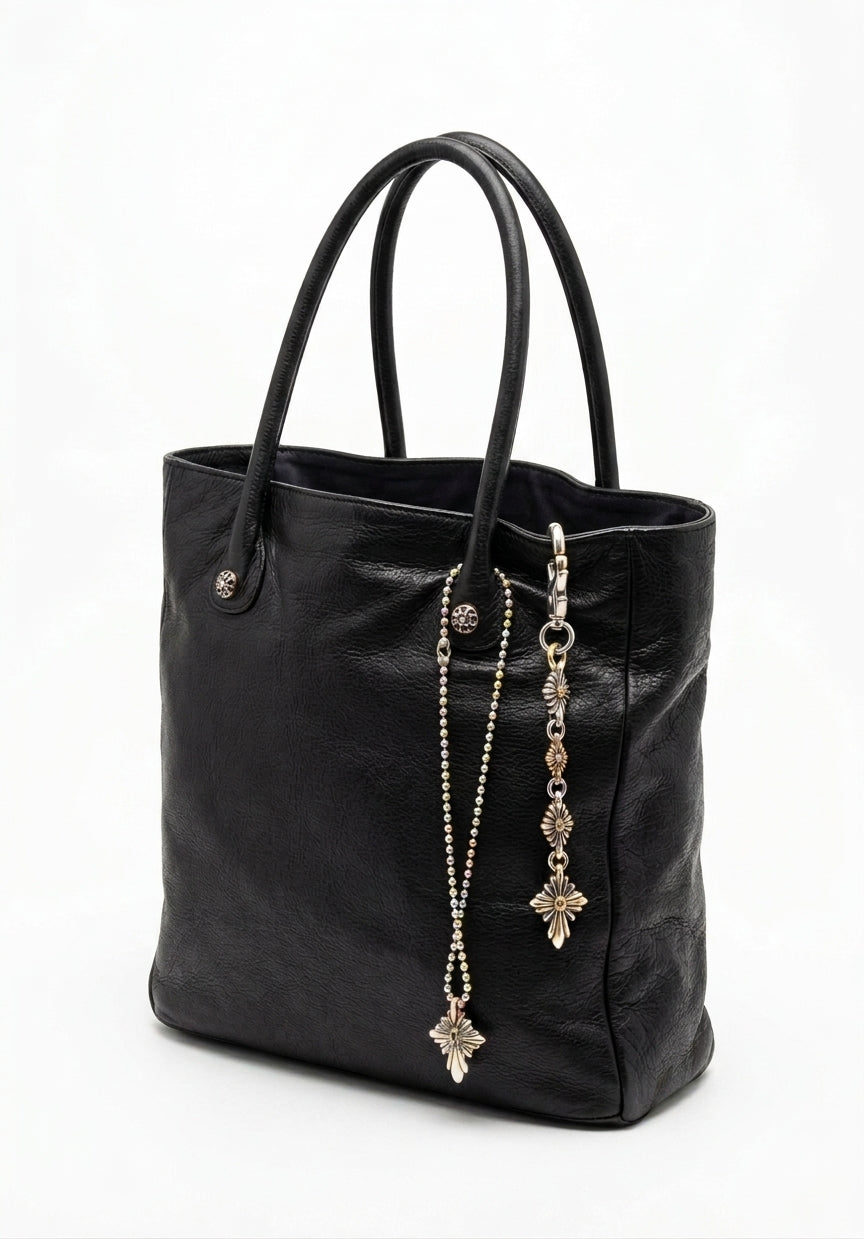 Nuevajo pendant worn on a leather tote